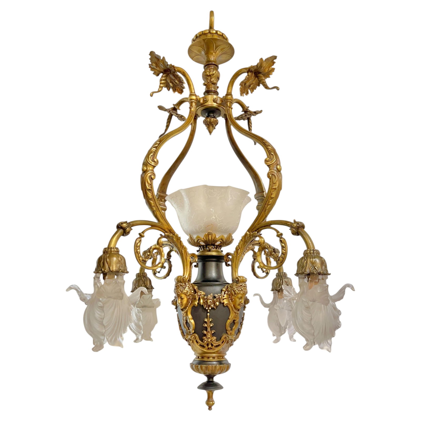 French Neoclassical Bronze Chandelier with Five Lights and Frosted Glass Shades: French Neoclassical Bronze Chandelier with Five Lights and Frosted Glass Shades This antique neoclassical chandelier features a patinated bronze urn standard adorned with foliate scrolls and masks of 