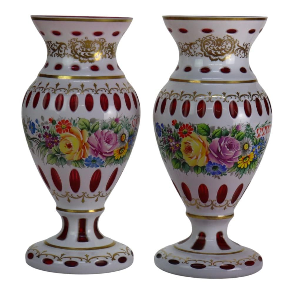 Set of 2 C1890 Hand Painted Gilt Cut Cranberry Bohemian Glass Vases: Set of 2 C1890 Hand Painted Gilt Cut Cranberry Bohemian Glass Vases This exquisite pair of oversized Bohemian glass vases, crafted circa 1890, showcases a stunning cut-to-cranberry technique. Each vas