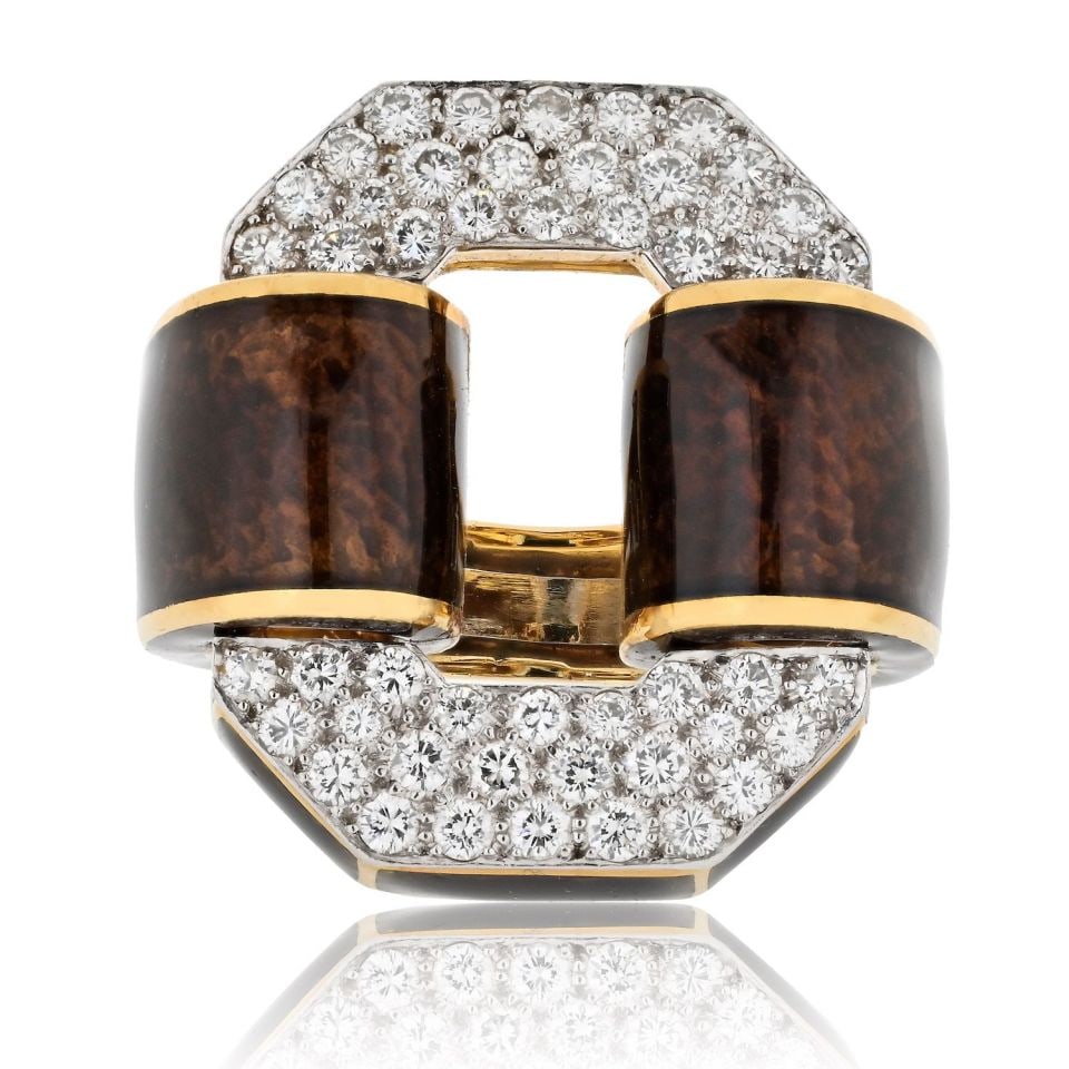 Tire Ring by David Webb in Platinum and 18K Gold with Diamond Accents: Tire Ring by David Webb in Platinum and 18K Gold with Diamond Accents This estate ring by David Webb features a bold, architectural design crafted in platinum and 18K yellow gold. The wide band is ado