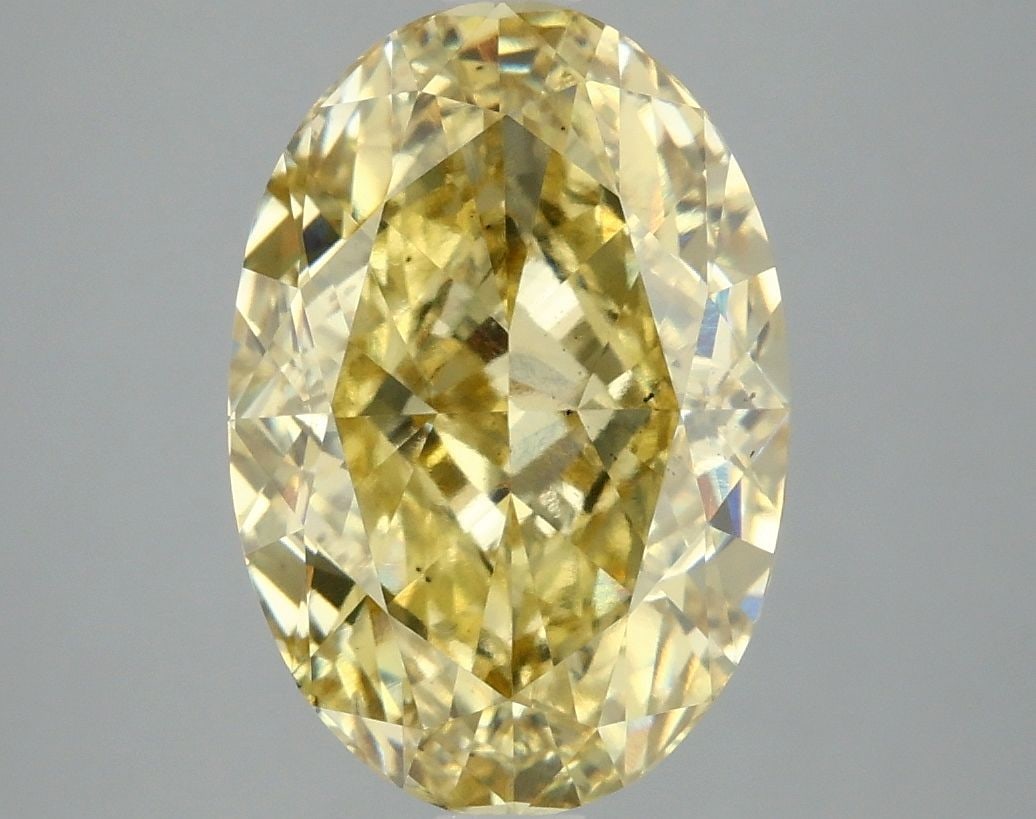 Loose Diamond - OVAL 4.76ct Fancy Vivid Yellow VS2: Loose Diamond - OVAL 4.76ct Fancy Vivid Yellow VS2 Source: This is a real non-mined Diamond that has been grown in a lab Shape: OVAL Carats: 4.76 Color: Fancy Vivid Yellow Certification: IGI Video: