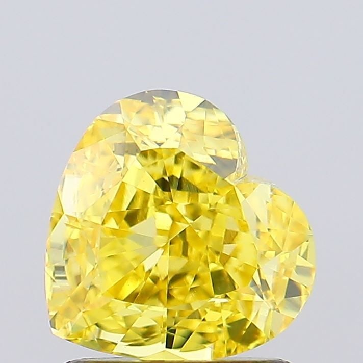 Loose Diamond - HEART 1.22ct Fancy Vivid Yellow VVS2: Loose Diamond - HEART 1.22ct Fancy Vivid Yellow VVS2 Source: This is a real non-mined Diamond that has been grown in a lab Shape: HEART Carats: 1.22 Color: Fancy Vivid Yellow Certification: IGI Video: