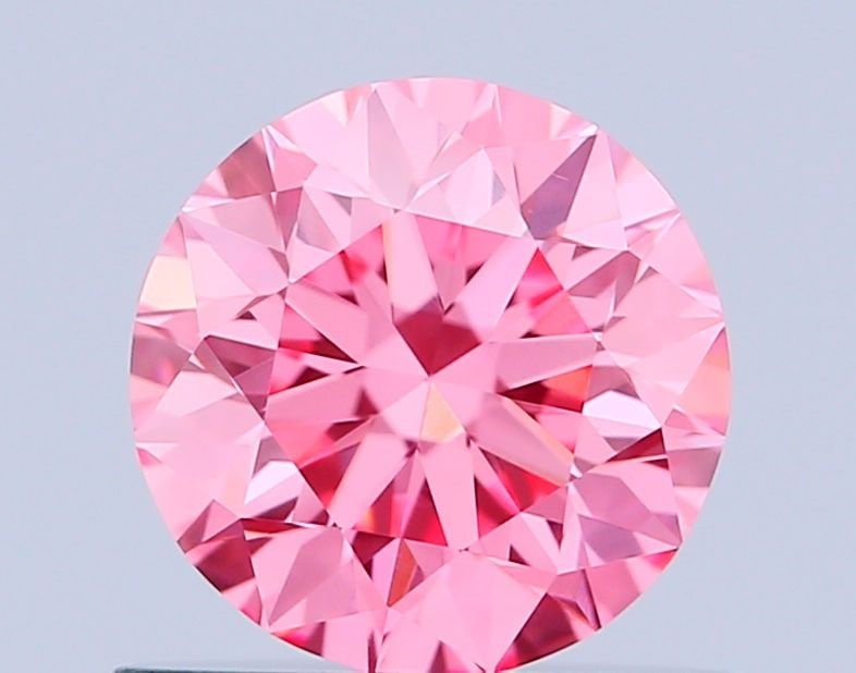 Loose Diamond - ROUND 0.64ct Fancy Vivid Pink VS1: Loose Diamond - ROUND 0.64ct Fancy Vivid Pink VS1 Source: This is a real non-mined Diamond that has been grown in a lab Shape: ROUND Carats: 0.64 Color: Fancy Vivid Pink Certification: IGI Video: