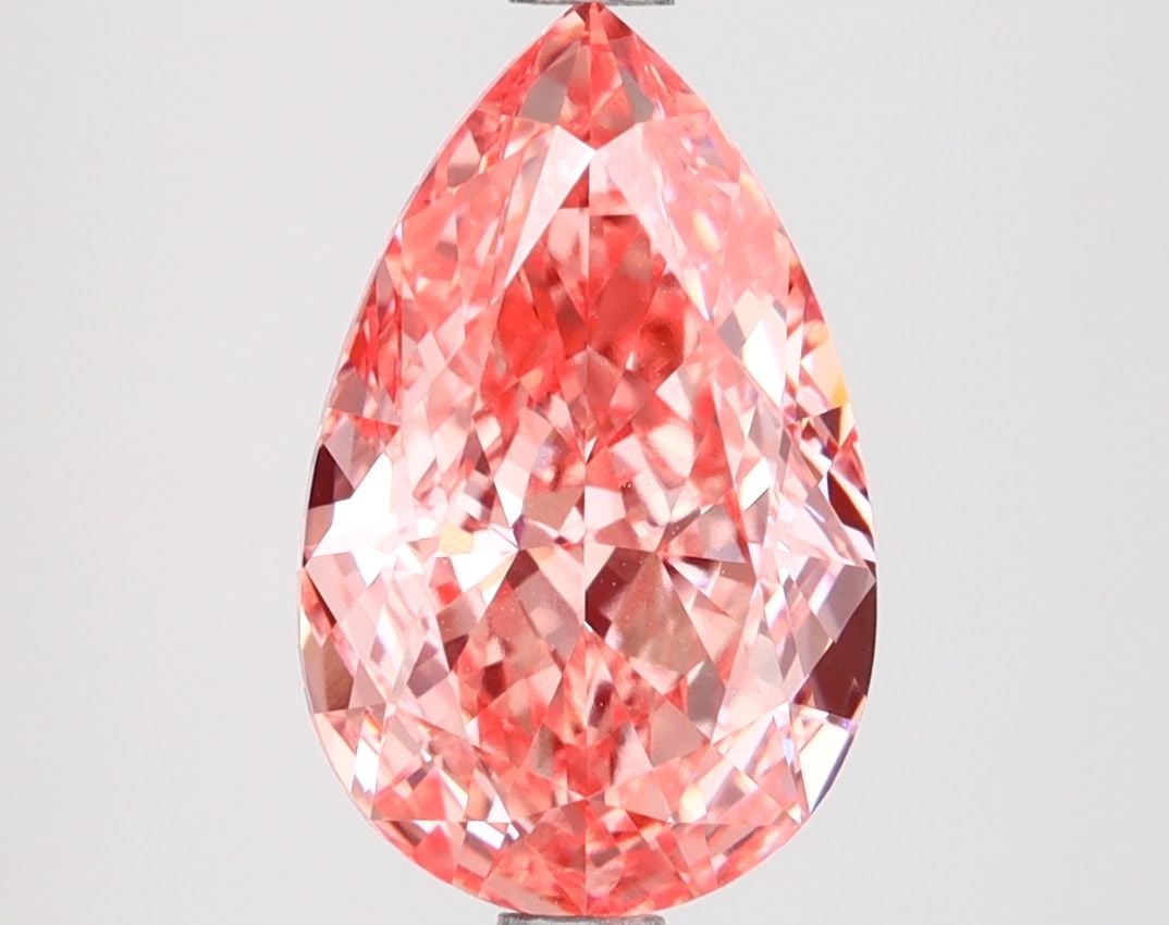 Loose Diamond - PEAR 2.88ct Fancy Vivid Pink VVS2: Loose Diamond - PEAR 2.88ct Fancy Vivid Pink VVS2 Source: This is a real non-mined Diamond that has been grown in a lab Shape: PEAR Carats: 2.88 Color: Fancy Vivid Pink Certification: IGI Video: