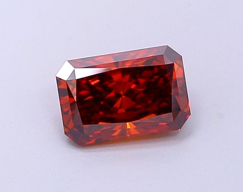 Loose Diamond - RADIANT 0.86ct Fancy Deep Orange VVS2: Loose Diamond - RADIANT 0.86ct Fancy Deep Orange VVS2 Source: This is a real non-mined Diamond that has been grown in a lab Shape: RADIANT Carats: 0.86 Color: Fancy Deep Orange Certification: IGI Vide