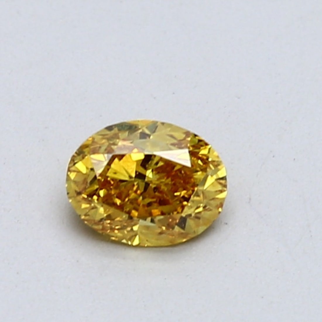 Loose Diamond - OVAL 0.53ct Fancy Vivid Orangey Yellow SI1: Loose Diamond - OVAL 0.53ct Fancy Vivid Orangey Yellow SI1 Source: Natural Shape: OVAL Carats: 0.53 Color: Fancy Vivid Orangey Yellow Certification: GIA Video: