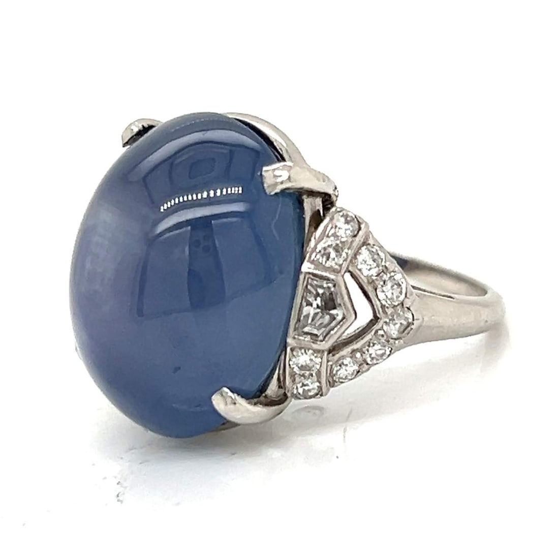 35 Ct Star Sapphire Ring with Diamonds in Platinum Setting: 35 Ct Star Sapphire Ring with Diamonds in Platinum Setting This stunning 35.00 Ct. Star Sapphire Ring features a striking star sapphire centerpiece complemented by 0.80 Ct. of diamonds set on a luxuri