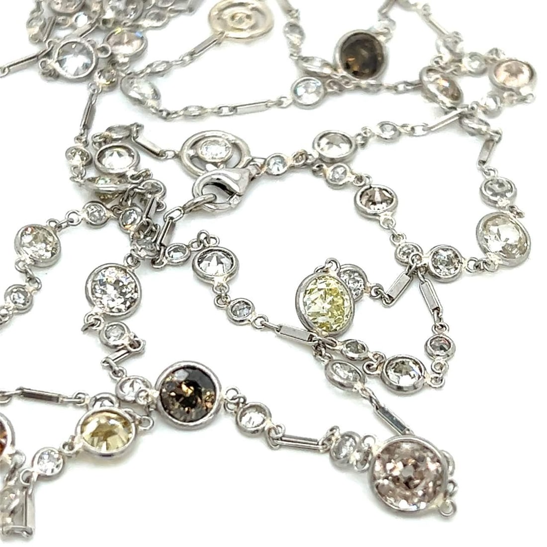 Art Deco Platinum Necklace 16.50 Ct White Natural Color Diamonds 42 Inches: Art Deco Platinum Necklace 16.50 Ct White Natural Color Diamonds 42 Inches This exquisite Art Deco necklace showcases a stunning combination of white and natural color diamonds meticulously crafted in
