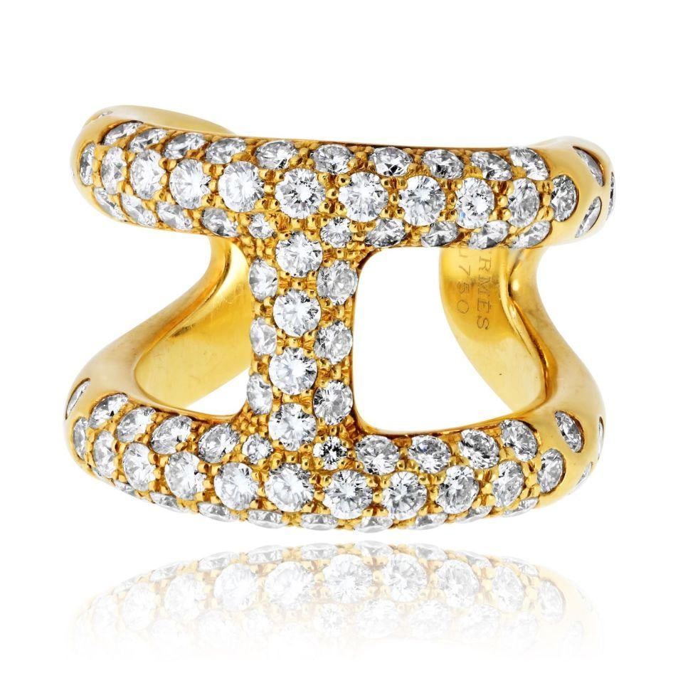Hermes Estate 18K Yellow Gold Pave Ring Size 55: Hermes Estate 18K Yellow Gold Pave Ring Size 55 This estate ring from Hermes is crafted from 18K yellow gold and features a pave design. The ring is pre-owned and has a substantial weight of 19.7 gram