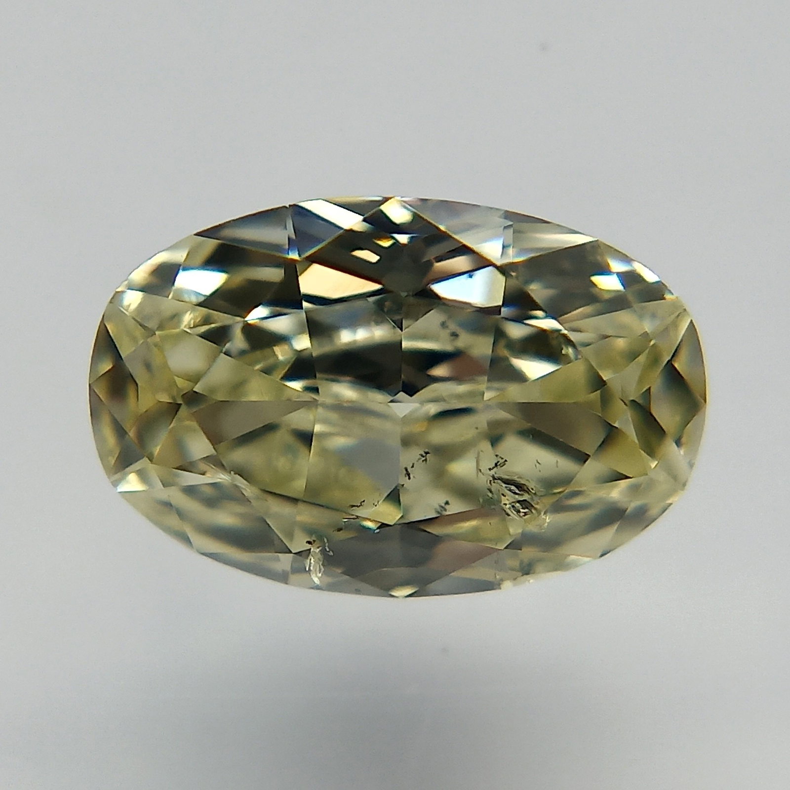 Loose Diamond - OVAL 0.55ct Fancy Light Yellow I1: Loose Diamond - OVAL 0.55ct Fancy Light Yellow I1 Source: Natural Shape: OVAL Carats: 0.55 Color: Fancy Light Yellow Certification: GIA PLEASE NOTE: Framed, Large, or heavy items do not have shipping 