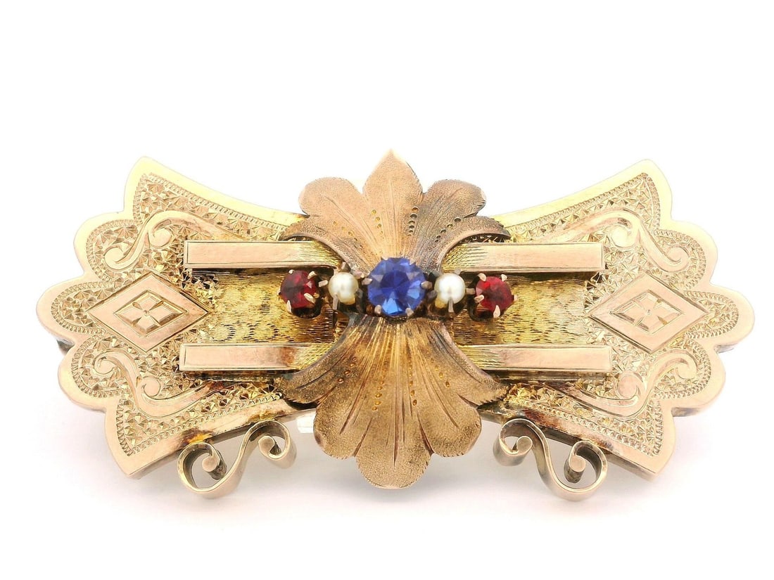 Antique Victorian 10k Gold Brooch with Blue Red Stones Seed Pearls: Antique Victorian 10k Gold Brooch with Blue Red Stones Seed Pearls This exquisite Antique Victorian brooch features a stunning design crafted from solid 10k yellow gold. It showcases a central blue st