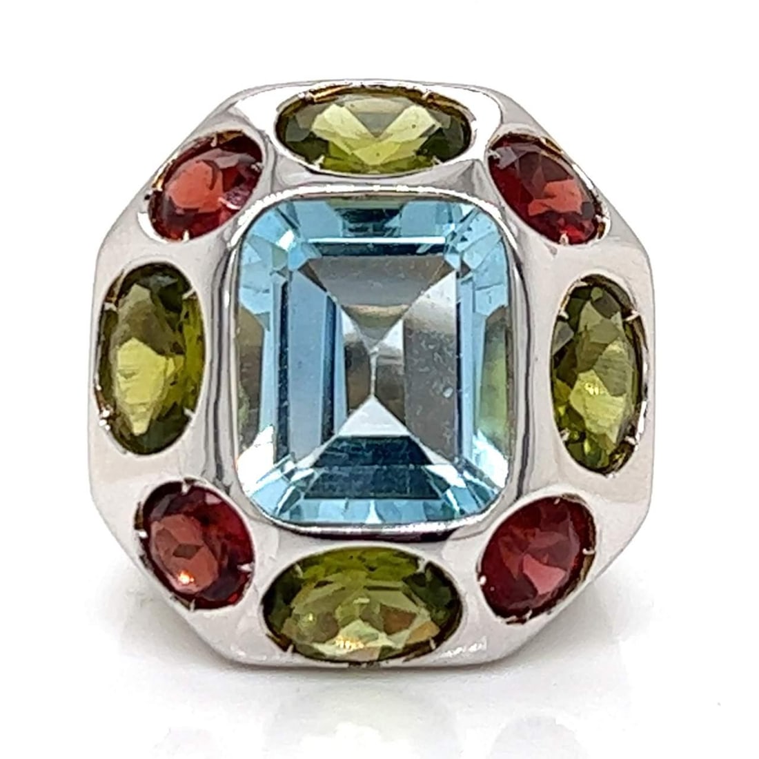 Elegant 18K White Gold Ring with 9 Semi-Precious Stones: Elegant 18K White Gold Ring with 9 Semi-Precious Stones This exquisite 18K white gold ring features a stunning arrangement of 9 semi-precious stones, collectively weighing approximately 12.00 ct. With