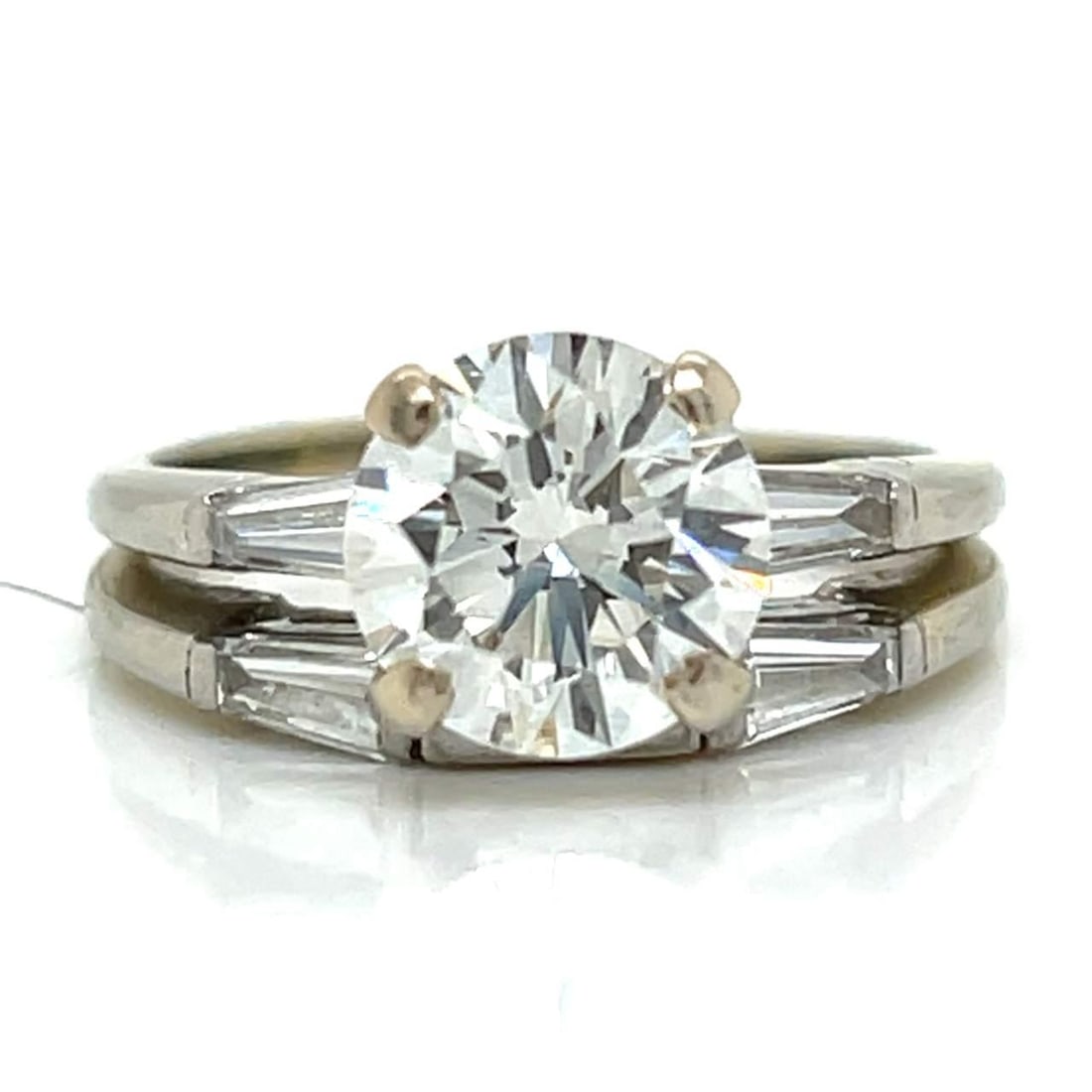 Elegant 18K White Gold GIA Certified 1.77 Ct Diamond Ring: Elegant 18K White Gold GIA Certified 1.77 Ct Diamond Ring This stunning 18K White Gold ring features a magnificent GIA Certified round diamond weighing 1.77 ct. With an I color and VS2 clarity, this c