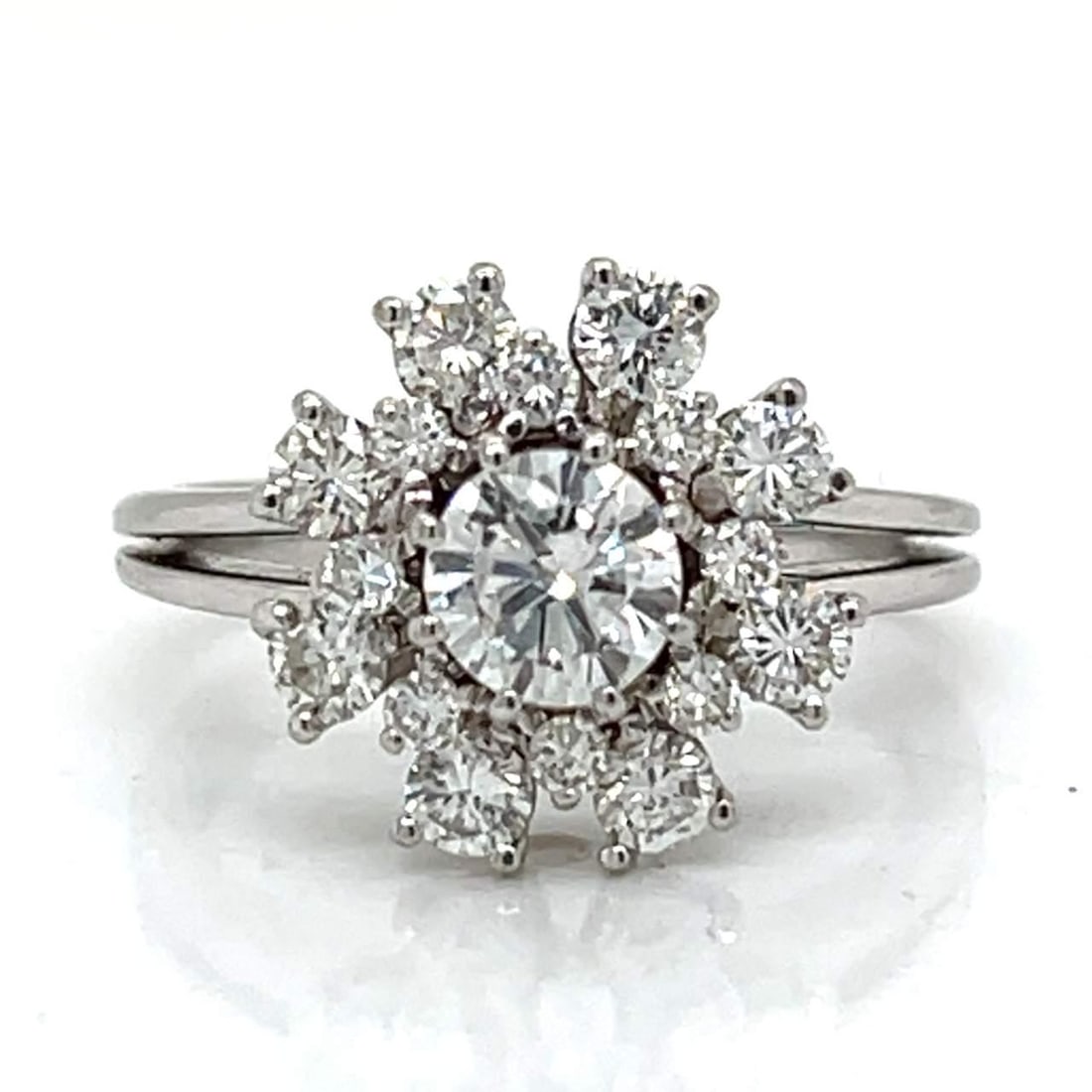 18K White Gold 1.70 Ct. Diamond Ring F Color VS2 Clarity: 18K White Gold 1.70 Ct. Diamond Ring F Color VS2 Clarity This stunning 18K White Gold Diamond Ring showcases a remarkable 1.70 ct. total diamond weight. At its center lies an approximately 0.70 ct. di