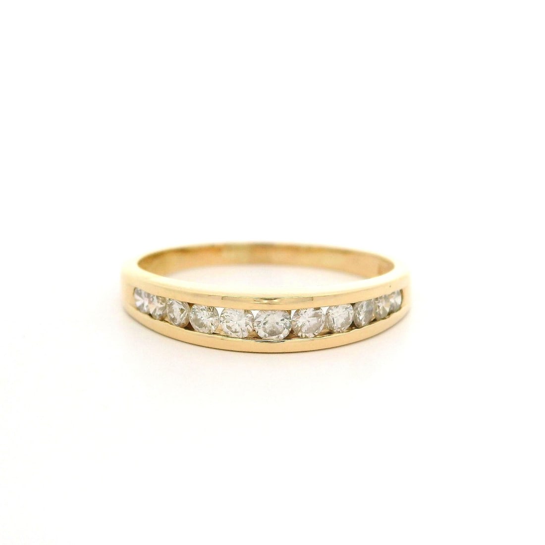 14k Yellow Gold 0.35ctw Channel Set Diamond Dome Ring: 14k Yellow Gold 0.35ctw Channel Set Diamond Dome Ring This stunning classic domed band ring is crafted from solid 14k yellow gold and features a contemporary design. It showcases a total of 11 natural