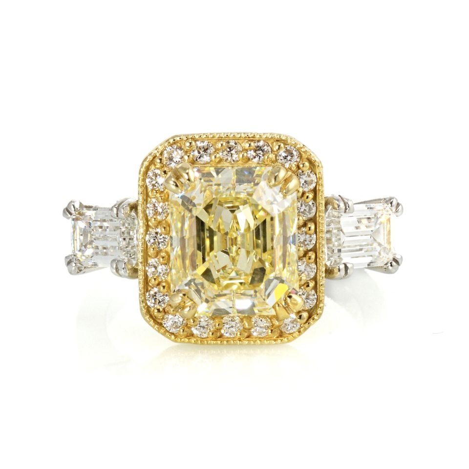 2.05ct Radiant Cut Fancy Yellow Diamond Ring Platinum 18K Gold: 2.05ct Radiant Cut Fancy Yellow Diamond Ring Platinum 18K Gold This exquisite ring features a stunning 2.05 carat Radiant Cut Fancy Yellow diamond, graded VS1 for clarity, showcased in an elegant sett