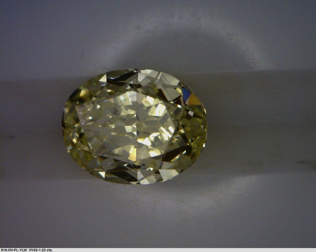 Loose Diamond - OVAL 1.23ct Fancy Light Yellow VVS2: Loose Diamond - OVAL 1.23ct Fancy Light Yellow VVS2 Source: Natural Shape: OVAL Carats: 1.23 Color: Fancy Light Yellow Certification: GIA PLEASE NOTE: Framed, Large, or heavy items do not have shippin