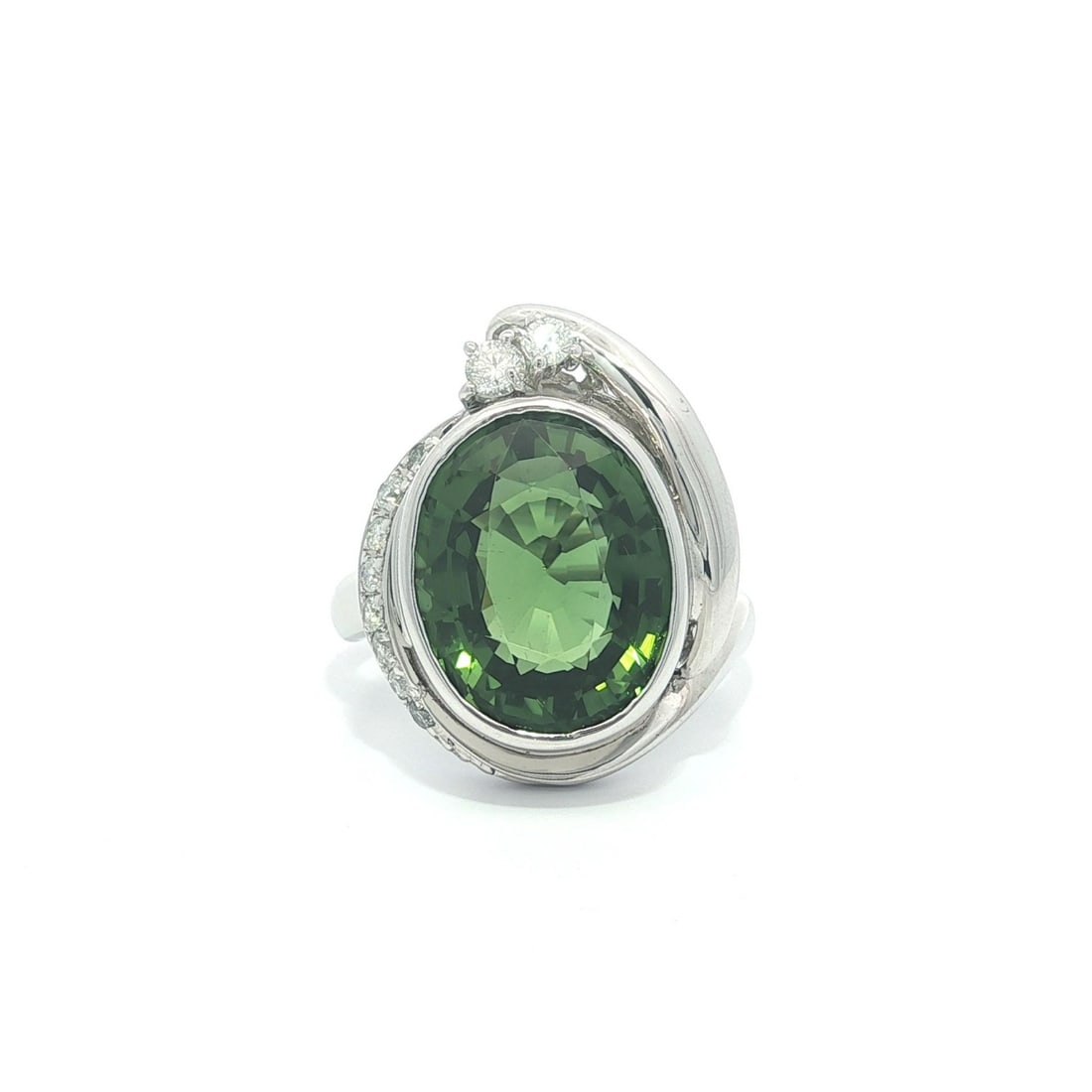 Platinum Oval Green Tourmaline and Diamond Cocktail Ring GIA Certified: Platinum Oval Green Tourmaline and Diamond Cocktail Ring GIA Certified This platinum statement ring features a natural oval brilliant cut green tourmaline, bezel set and displaying a clean yellowish-g