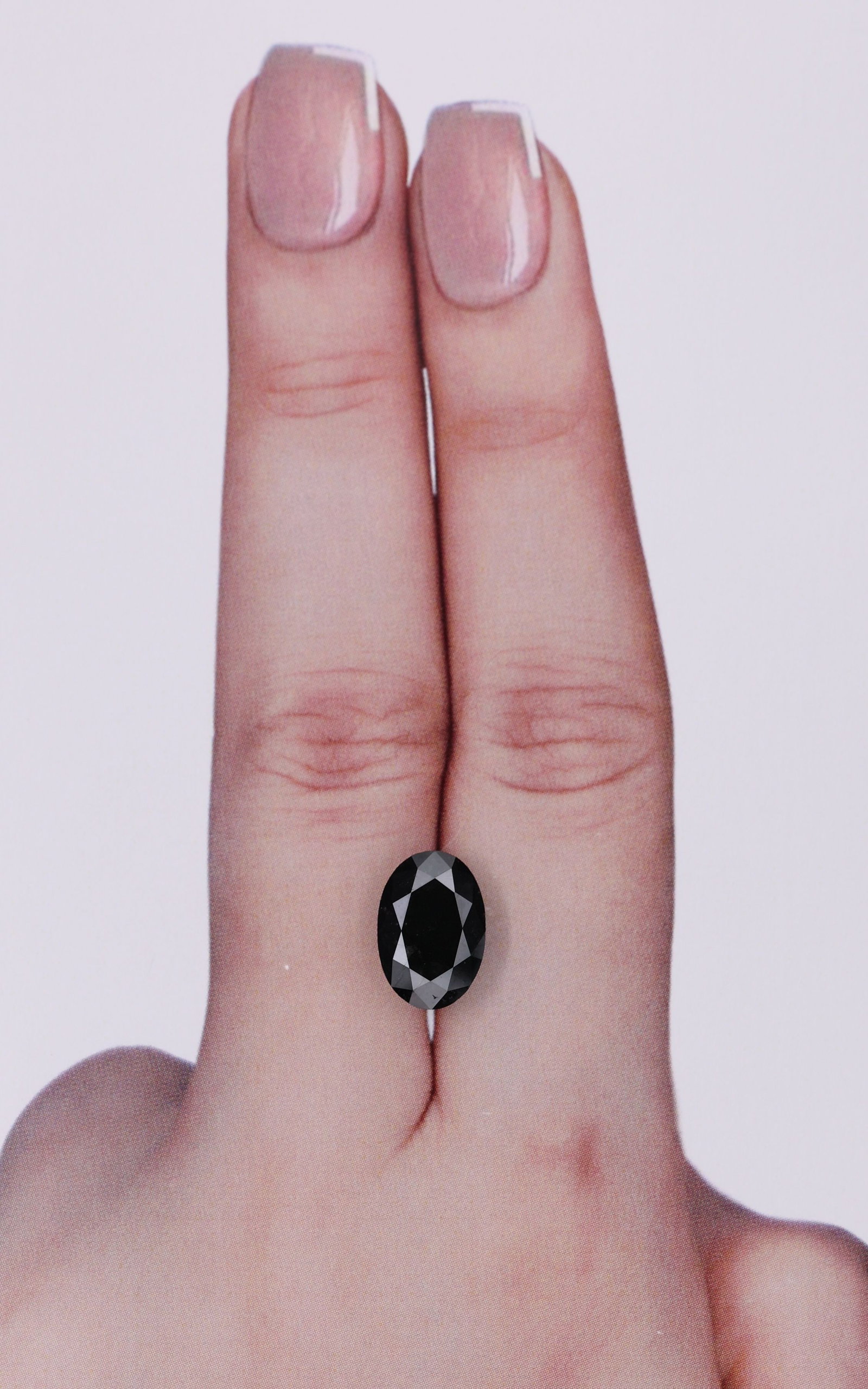 Loose Diamond - OVAL 3.21ct Black: Loose Diamond - OVAL 3.21ct Black Source: Natural Shape: OVAL Carats: 3.21 Color: Black Certification: IGI Video: