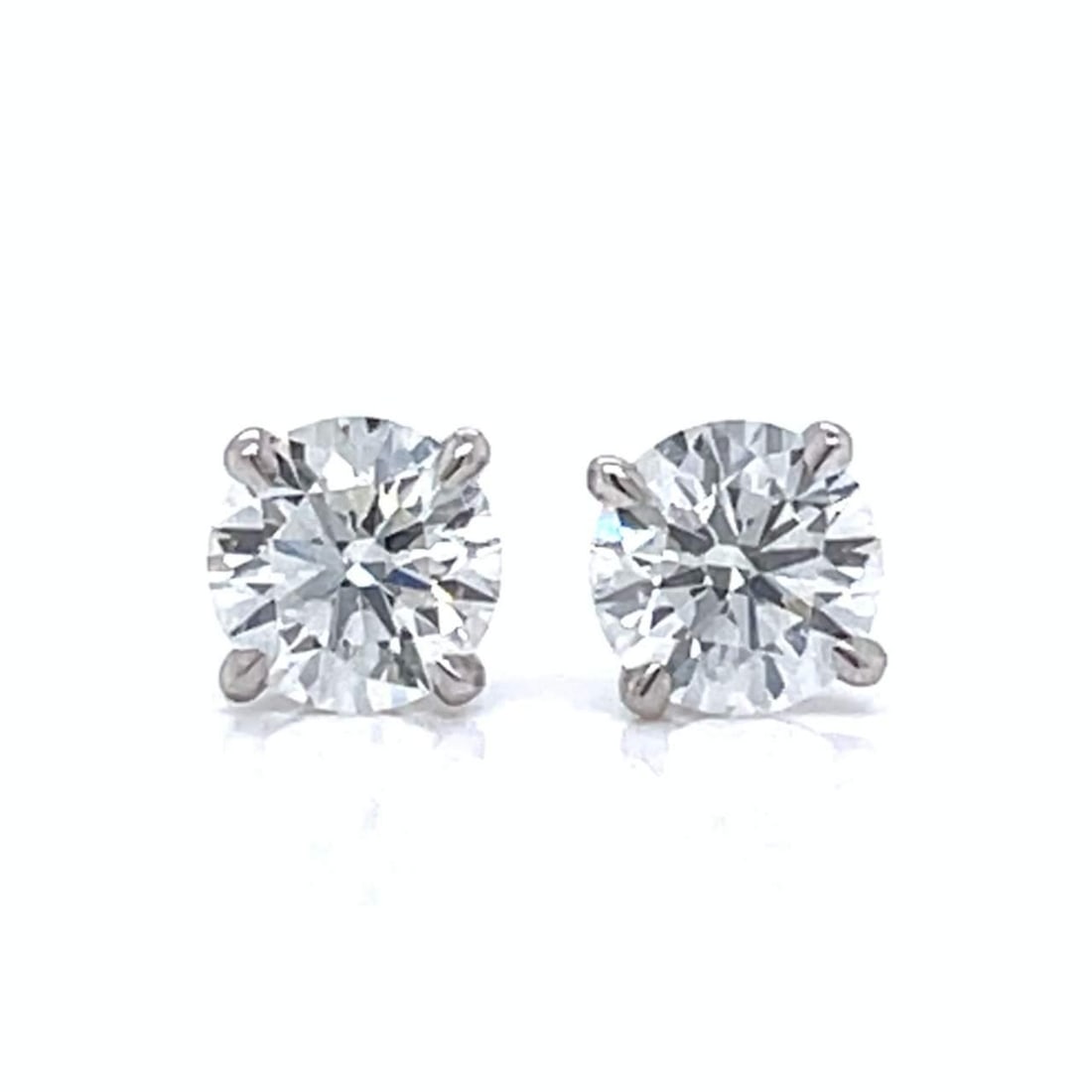 Elegant 14K White Gold 1.00 Ct Diamond Stud Earrings: Elegant 14K White Gold 1.00 Ct Diamond Stud Earrings These stunning 14K White Gold Diamond Stud Earrings feature two exquisite diamonds totaling approximately 1.00 Ct. With a F-G color grade and VS1-V
