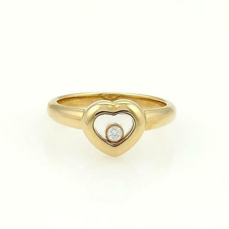 Chopard Happy Diamond 18k Yellow Gold Heart Ring with Floating Diamond Cert: Chopard Happy Diamond 18k Yellow Gold Heart Ring with Floating Diamond Cert Experience elegance with this authentic Chopard Happy Diamond heart ring, expertly crafted from 18k yellow gold. This exquis