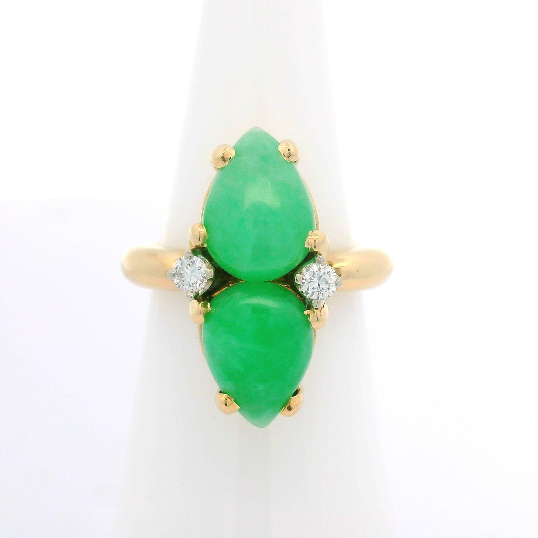 Vintage 14k Yellow Gold Teardrop Jade Diamond Cocktail Ring: Vintage 14k Yellow Gold Teardrop Jade Diamond Cocktail Ring This stunning vintage cocktail twin ring features a captivating design crafted from solid 14k yellow gold. The ring showcases two natural ja