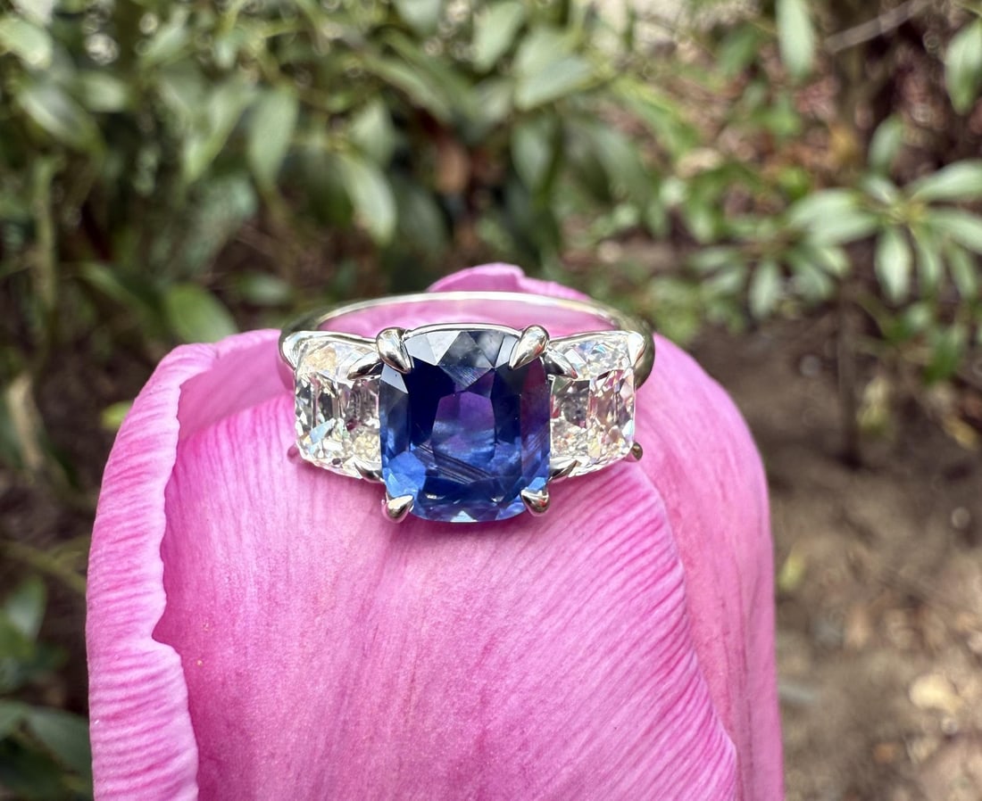 GIA Certified Platinum Three Stone Ring With Ceylon Sapphire and Old Mine Diamonds: GIA Certified Platinum Three Stone Ring With Ceylon Sapphire and Old Mine Diamonds This vintage platinum three-stone cocktail ring features a certified 3.42 carat natural Ceylon sapphire with a cushio