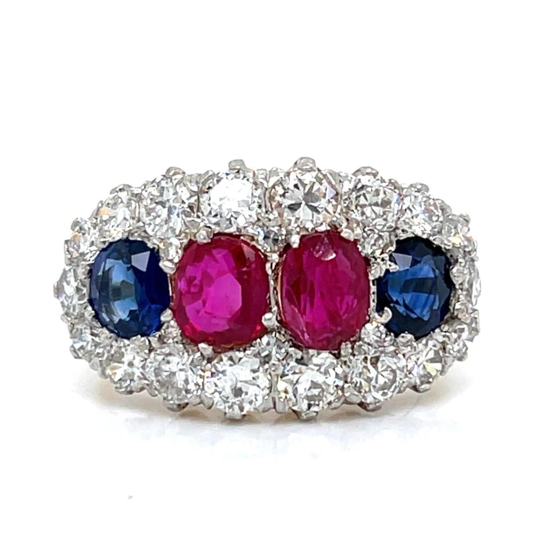 Antique 18K Gold Platinum Ruby Sapphire Diamond Ring: Antique 18K Gold Platinum Ruby Sapphire Diamond Ring This exquisite antique ring features a stunning combination of 18K yellow gold and platinum, showcasing two Burma no-heat rubies weighing approxima