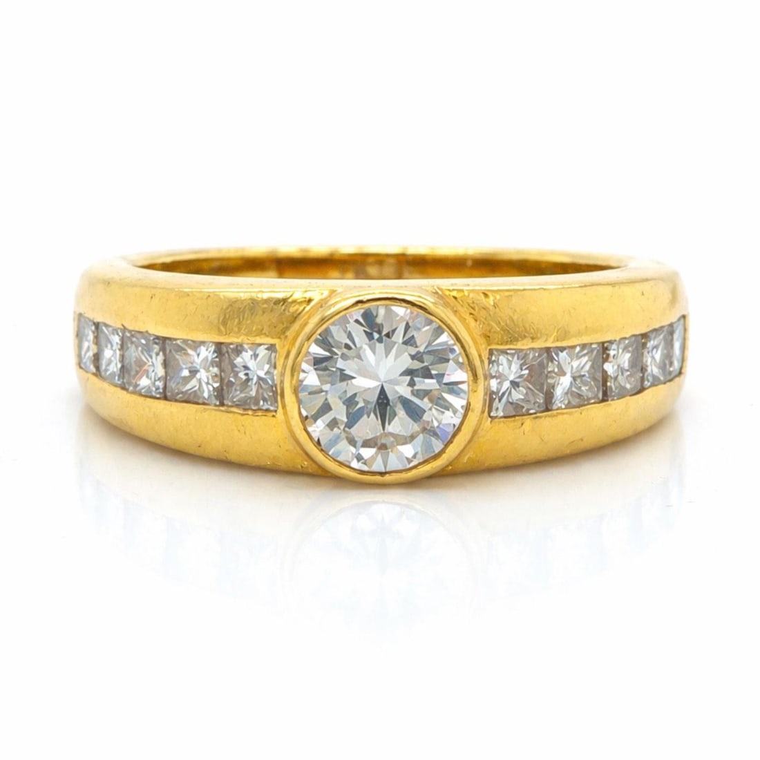 18K Yellow Gold Diamond Ring by Tiffany with Center and Quadrillion Diamonds: 18K Yellow Gold Diamond Ring by Tiffany with Center and Quadrillion Diamonds This Tiffany & Co. ring is crafted from 18K yellow gold and features a center diamond weighing 0.43 carats, complemented by