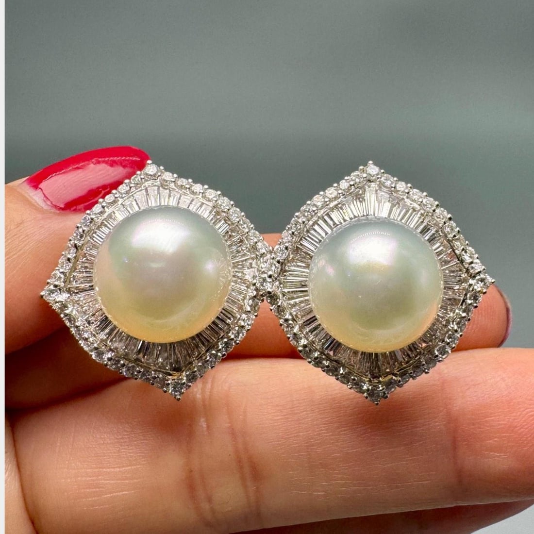 Pair of 18K White Gold Earrings with South Sea Pearls and Diamonds: Pair of 18K White Gold Earrings with South Sea Pearls and Diamonds These elegant earrings are crafted in 18K white gold and feature two South Sea pearls measuring 13.4mm each. They are adorned with 80