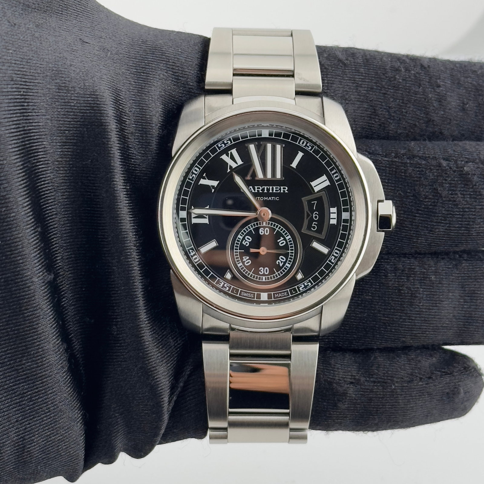 2013 Cartier Calibre Ref 3389 Stainless Steel Watch With Papers: 2013 Cartier Calibre Ref 3389 Stainless Steel Watch With Papers This is a Cartier Calibre wristwatch featuring a black dial and reference number 3389. The watch is crafted from stainless steel, has a 