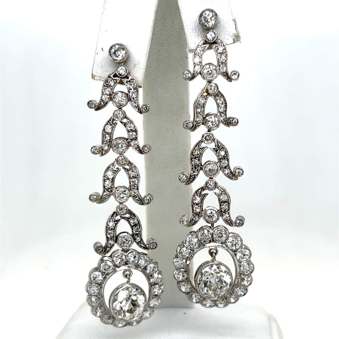 Art Deco Platinum 11.00 Ct Diamond Earrings with European-Cut Gems: Art Deco Platinum 11.00 Ct Diamond Earrings with European-Cut Gems These exquisite Art Deco earrings are crafted in platinum and feature a stunning total diamond weight of 11.00 Ct. The design include