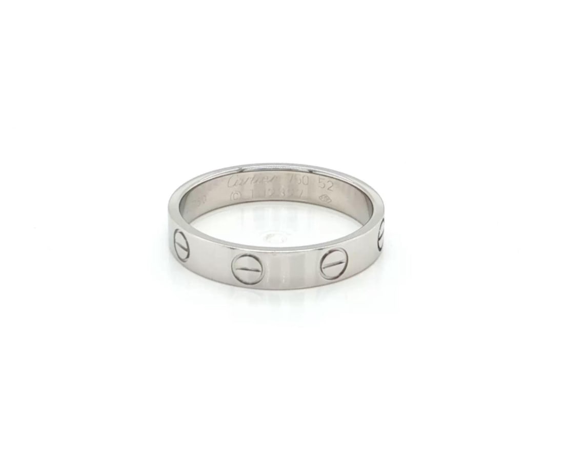 Cartier Love Mini Band Ring 18k White Gold 3.6mm Size 52 US 6: Cartier Love Mini Band Ring 18k White Gold 3.6mm Size 52 US 6 This Cartier Mini Love band ring is crafted from solid 18k white gold and features a high-polished finish. The slim, 3.6mm-wide band showc
