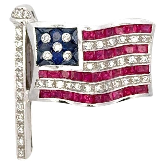 Patriotic Brooch with Diamonds Rubies Sapphires in 18k White Gold: Patriotic Brooch with Diamonds Rubies Sapphires in 18k White Gold This American flag brooch is crafted from 18 karat white gold and features round cut diamonds, rubies, and sapphires. Designed in a co