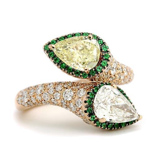 18K Rose Gold GIA Certified Fancy Yellow Diamond Ring 2.00 Ct: 18K Rose Gold GIA Certified Fancy Yellow Diamond Ring 2.00 Ct This stunning 18K Rose Gold ring features a GIA Certified Fancy Yellow Diamond, weighing 2.00 Ct. The pear-shaped diamond exhibits a Fancy