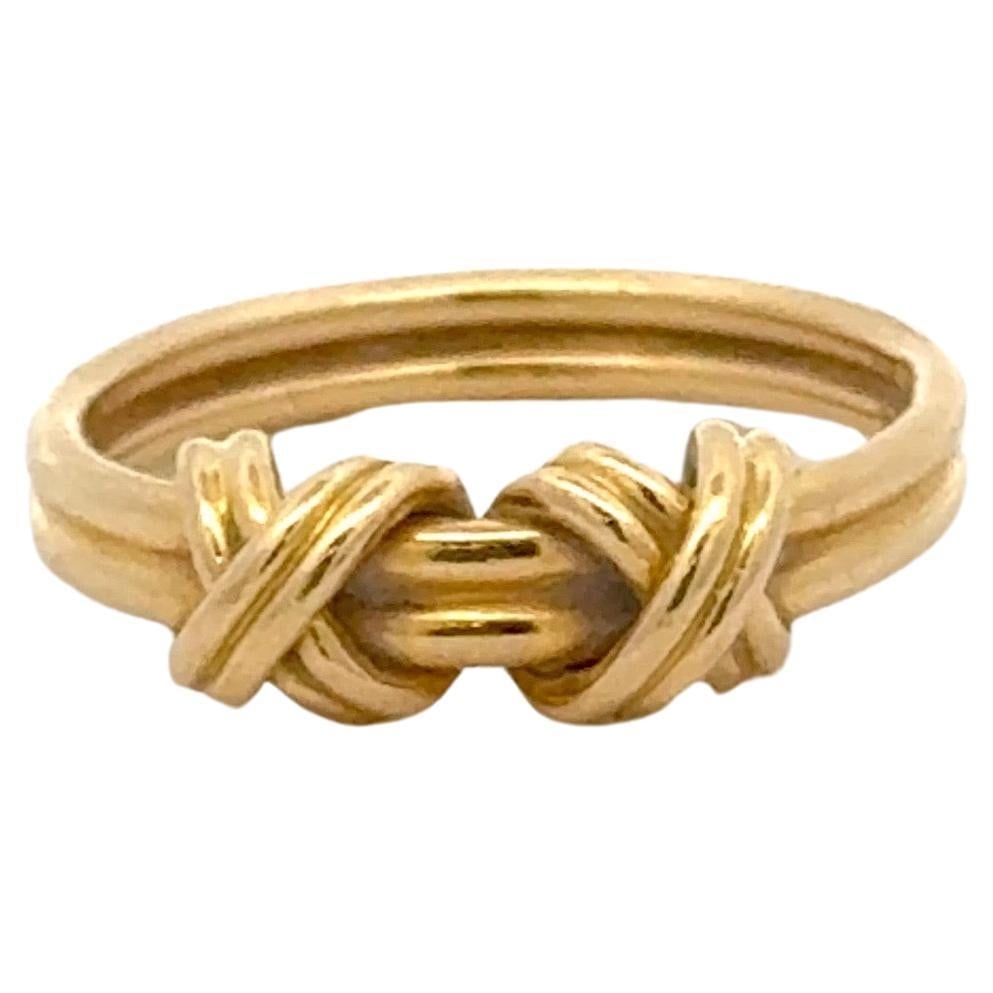 Tiffany & Co 18K Yellow Gold Double X Band Ring 4 US: Tiffany & Co 18K Yellow Gold Double X Band Ring 4 US This stunning band ring from Tiffany & Co. features a contemporary double 'X' design crafted from 18 karat yellow gold. Weighing 5.4 grams and with