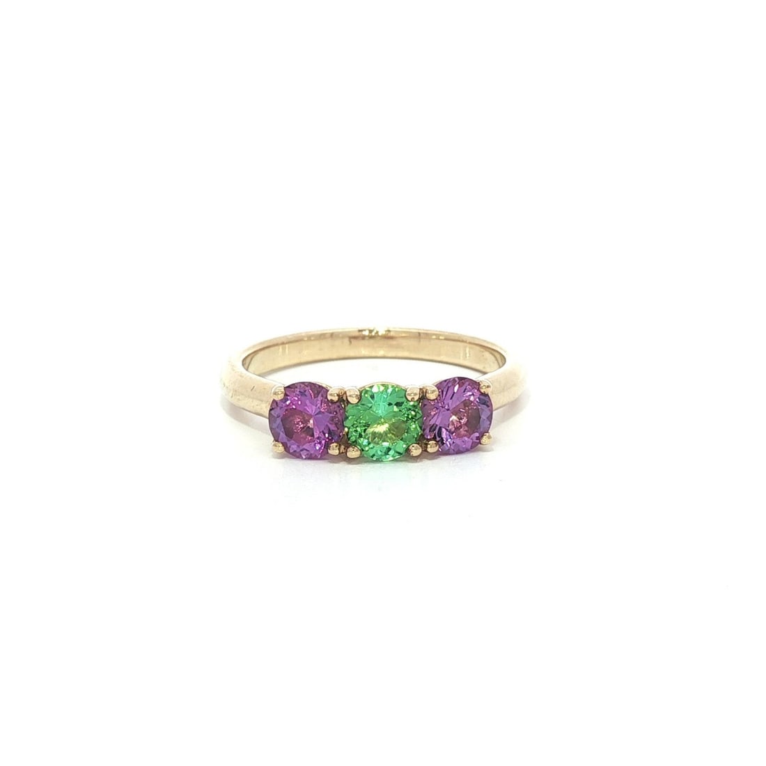 10k Yellow Gold Amethyst & Quartz 3 Stone Ring: 10k Yellow Gold Amethyst & Quartz 3 Stone Ring This exquisite 10k yellow gold ring features a stunning trio of gemstones: one pastel green quartz and two pastel purple amethysts. The natural stones ar