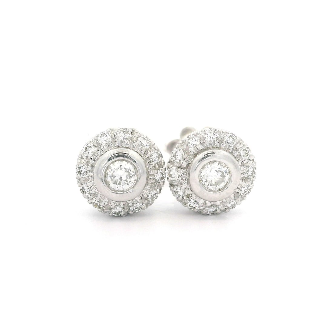 18k White Gold 0.45ctw Diamond Halo Stud Earrings with Butterfly Closures: 18k White Gold 0.45ctw Diamond Halo Stud Earrings with Butterfly Closures These stunning stud earrings are crafted from solid 18k white gold and feature a halo design adorned with 26 natural genuine d