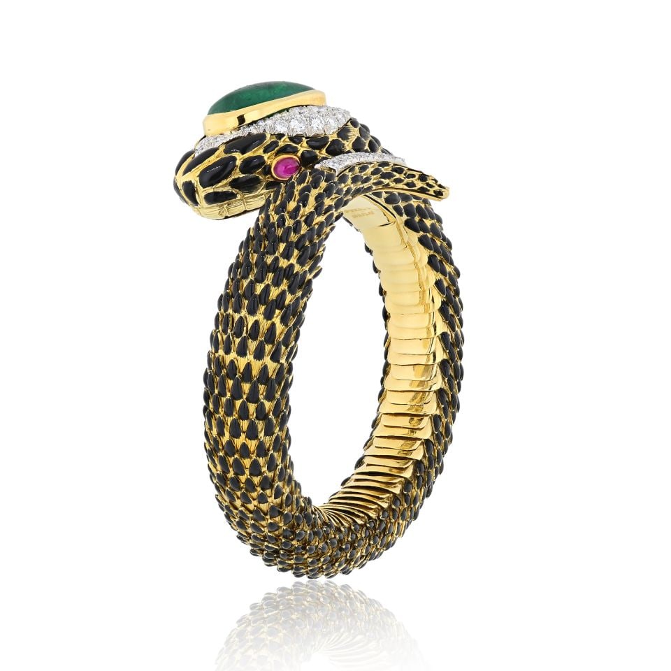 David Webb Snake Bracelet Platinum 18K Yellow Gold Emerald Ruby Diamonds: David Webb Snake Bracelet Platinum 18K Yellow Gold Emerald Ruby Diamonds This exquisite David Webb bracelet showcases a stunning snake design, crafted from both platinum and 18K yellow gold. Featuring