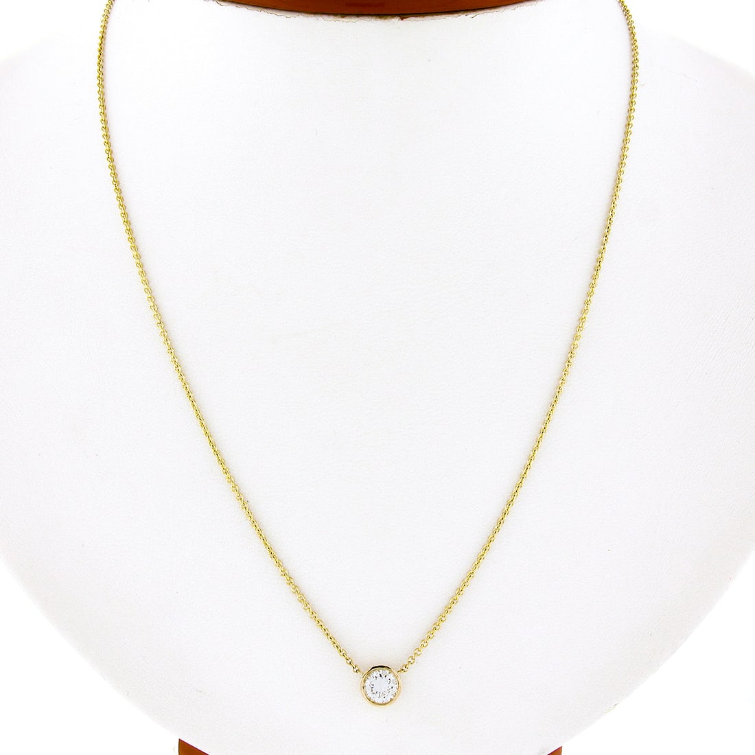 14k Yellow Gold 0.60ct Diamond Bezel Pendant Necklace Adjustable 16-18in: 14k Yellow Gold 0.60ct Diamond Bezel Pendant Necklace Adjustable 16-18in This exquisite 14k yellow gold pendant features a stunning round bezel-set diamond solitaire, weighing a total of 0.60 carats. 