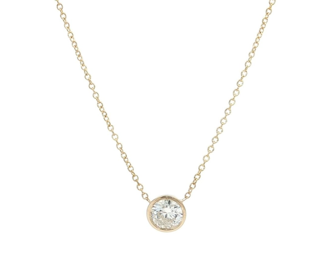 14k Yellow Gold 0.76ct Bezel Diamond Pendant Necklace Adjustable Chain: 14k Yellow Gold 0.76ct Bezel Diamond Pendant Necklace Adjustable Chain This exquisite 14k Yellow Gold necklace features a stunning .76ctw Bezel Diamond Solitaire Pendant, designed to elevate any ensem