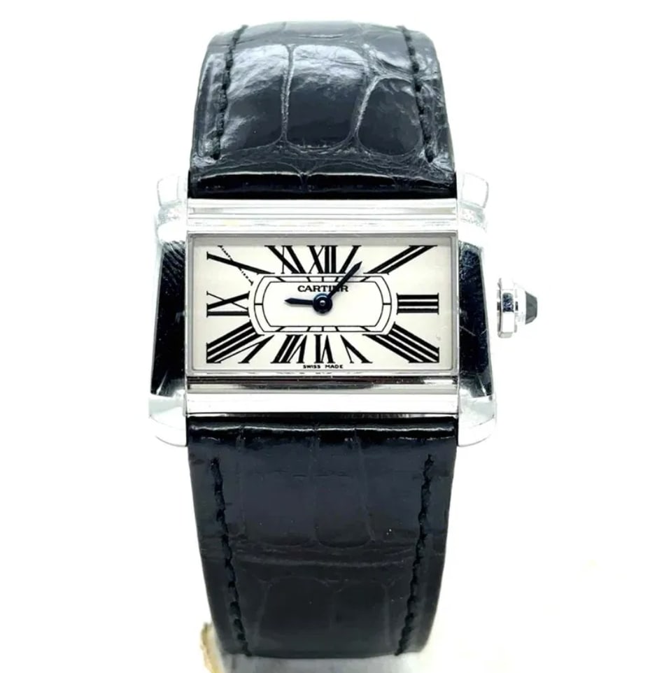 Tank Divan Roman Dial Watch with Leather Band Ref 2599/W6300255: Tank Divan Roman Dial Watch with Leather Band Ref 2599/W6300255 This Cartier Tank Divan watch features a silver Roman numeral dial, a smooth bezel, and a leather bracelet. The reference number is 2599