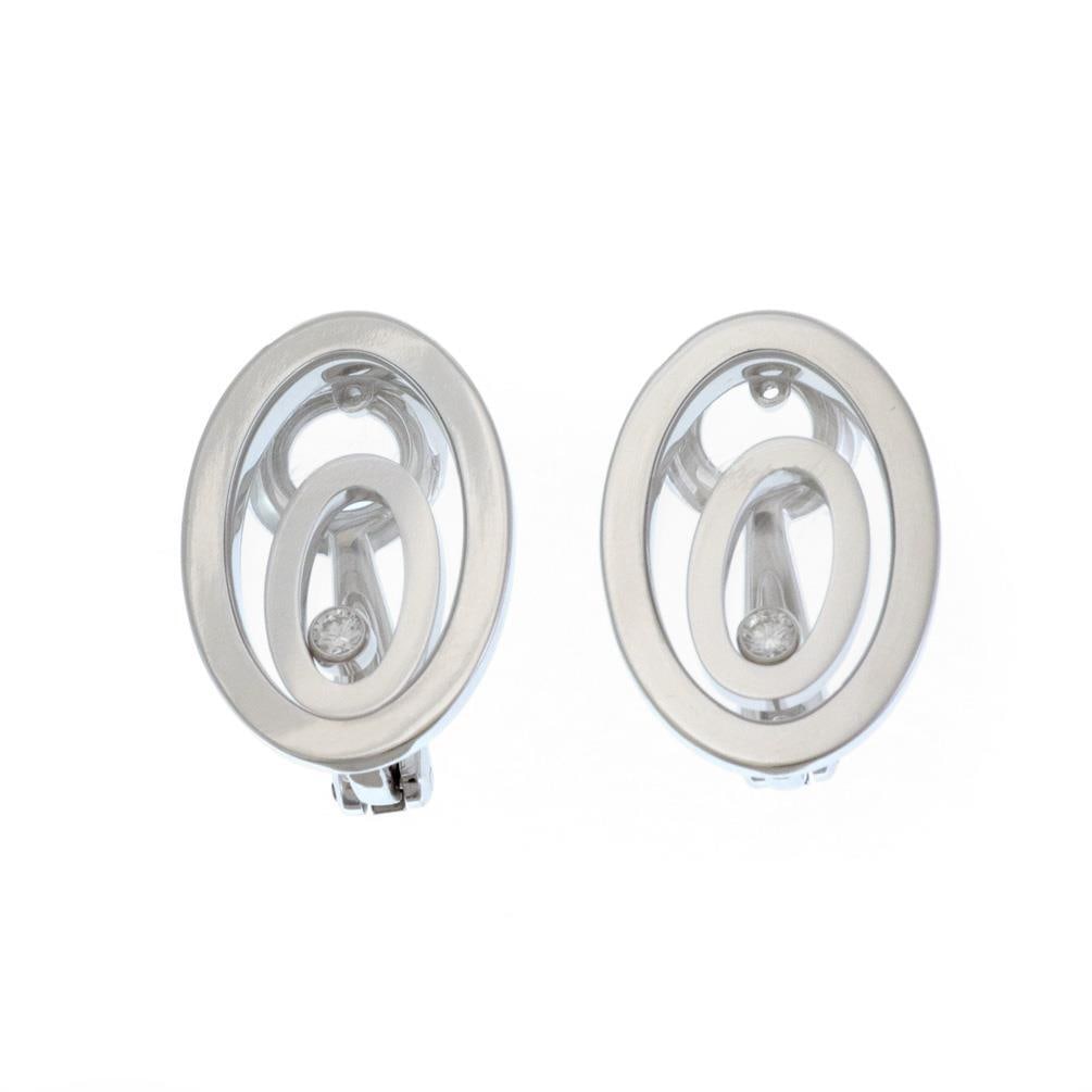 Chopard Happy Spirit 18k White Gold Double Oval Clip-On Earrings with Diamond: Chopard Happy Spirit 18k White Gold Double Oval Clip-On Earrings with Diamond This exquisite pair of earrings from Chopard's Happy Spirit Collection showcases a sophisticated design crafted from 18k w