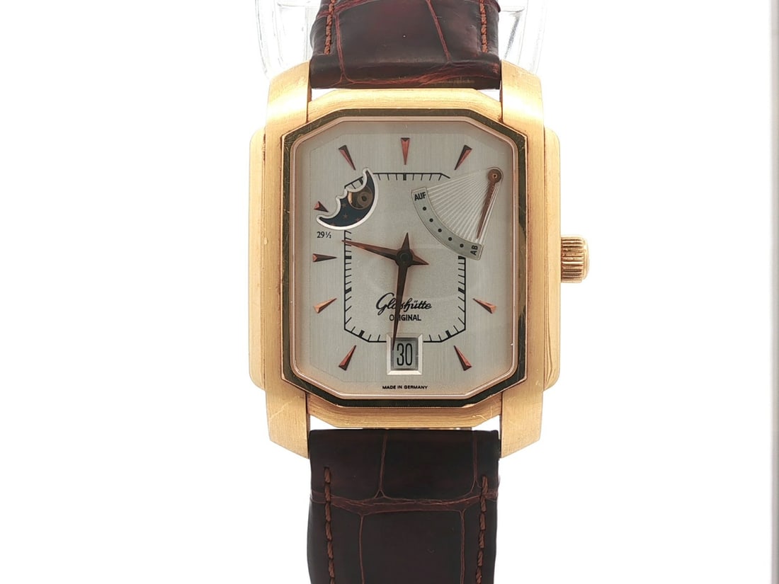 34mm 18k Yellow Gold Glashutte Original Automatic Moonphase Wristwatch Ref 39-45-07-05-04: 34mm 18k Yellow Gold Glashutte Original Automatic Moonphase Wristwatch Ref 39-45-07-05-04 This Glashutte Original wristwatch features a solid 18k yellow gold case with a cushion shape and a smooth gol