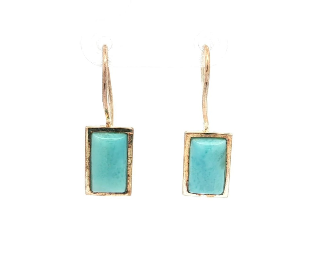 Handmade Sterling Silver Turquoise Geometric Drop Earrings: Handmade Sterling Silver Turquoise Geometric Drop Earrings Elevate your jewelry collection with these Handmade Sterling Silver Turquoise Cabochon Geometric Drop Earrings. Featuring two natural genuine