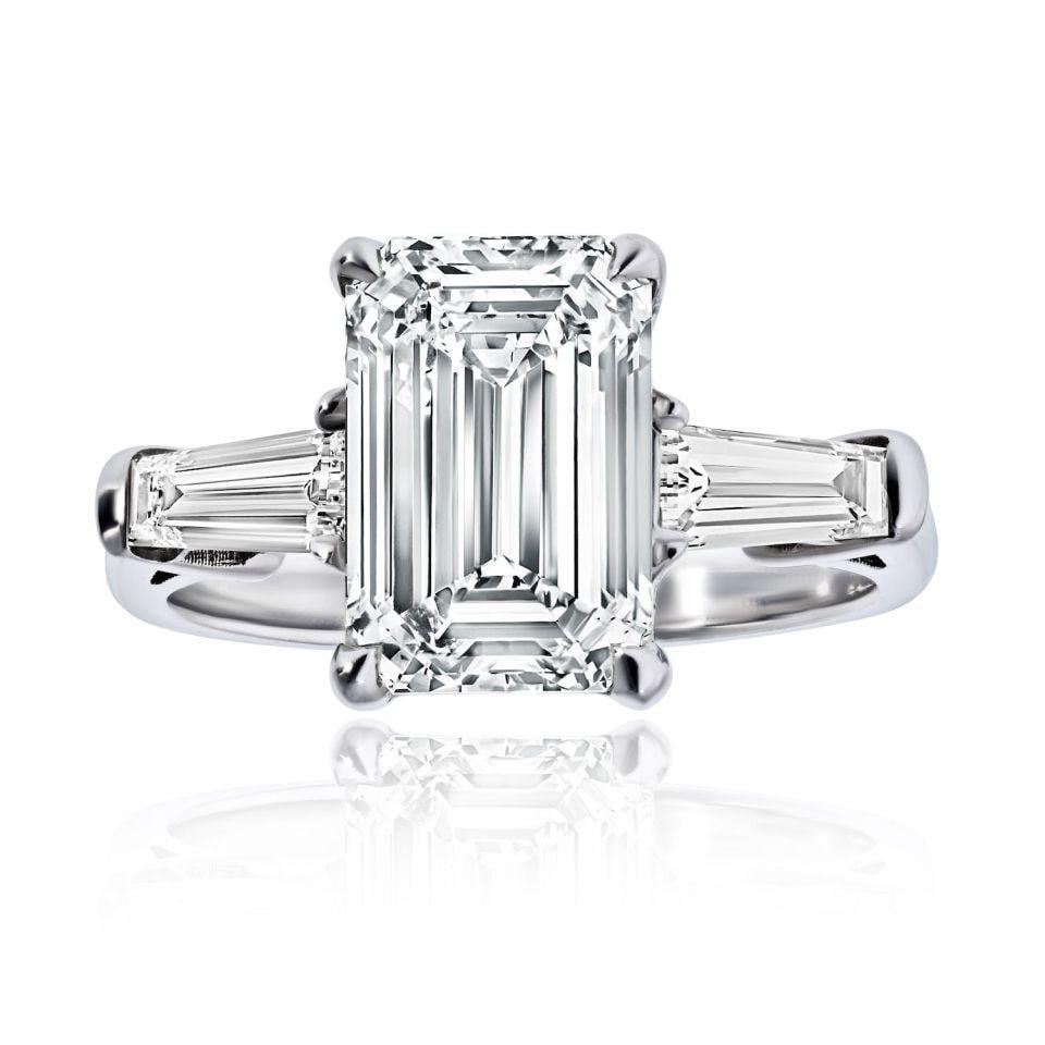 Emerald Cut 3.01 Carat I SI1 GIA Certified Diamond Engagement Ring: Emerald Cut 3.01 Carat I SI1 GIA Certified Diamond Engagement Ring This classic three-stone engagement ring features a natural, earth-mined 3.01 carat emerald cut diamond with I color and SI1 clarity,