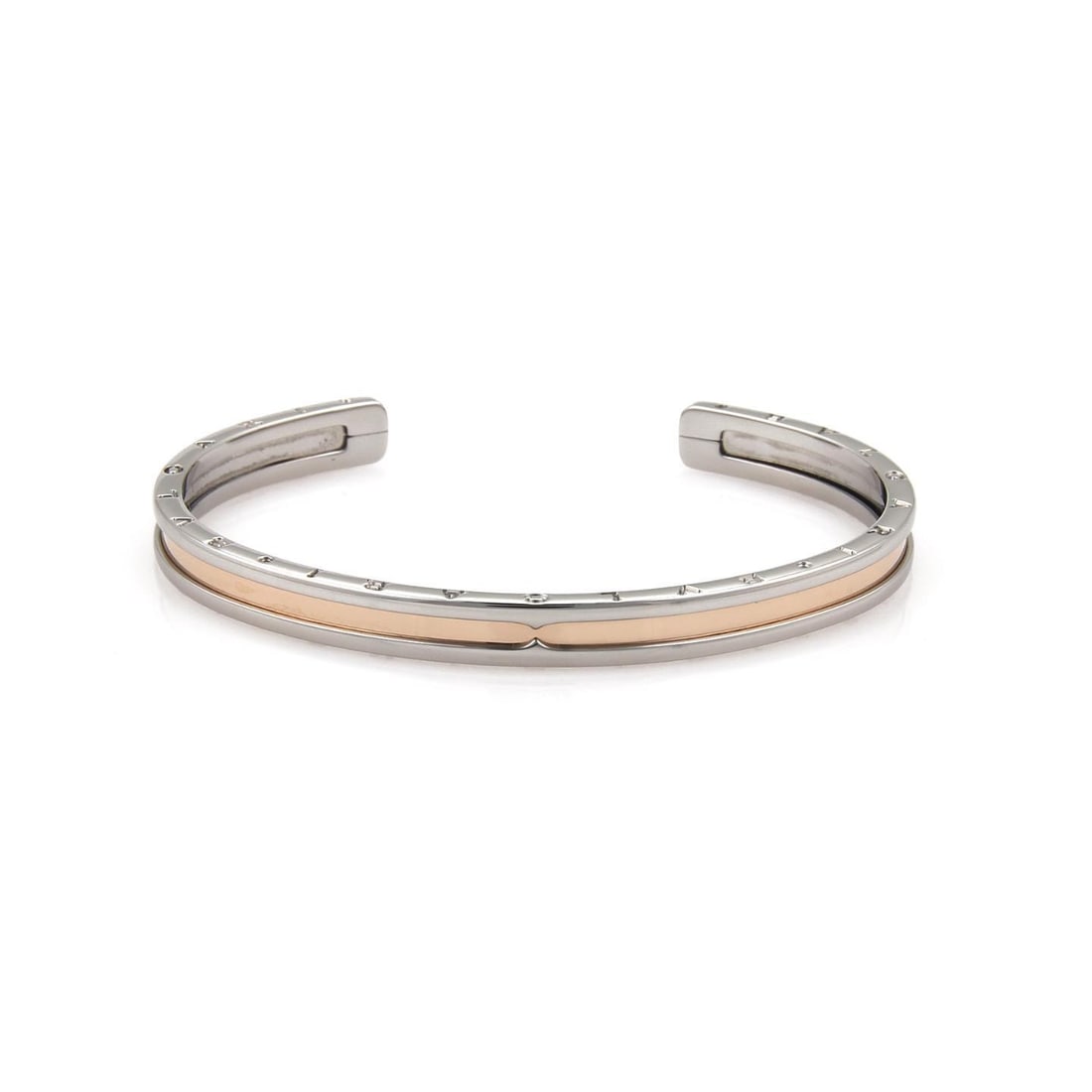 Bvlgari B Zero-1 Engraved Cuff Bracelet Steel 18k Rose Gold: Bvlgari B Zero-1 Engraved Cuff Bracelet Steel 18k Rose Gold Discover the sophistication of this authentic Bvlgari cuff bracelet from the distinguished B Zero-1 collection. Crafted from durable stainle