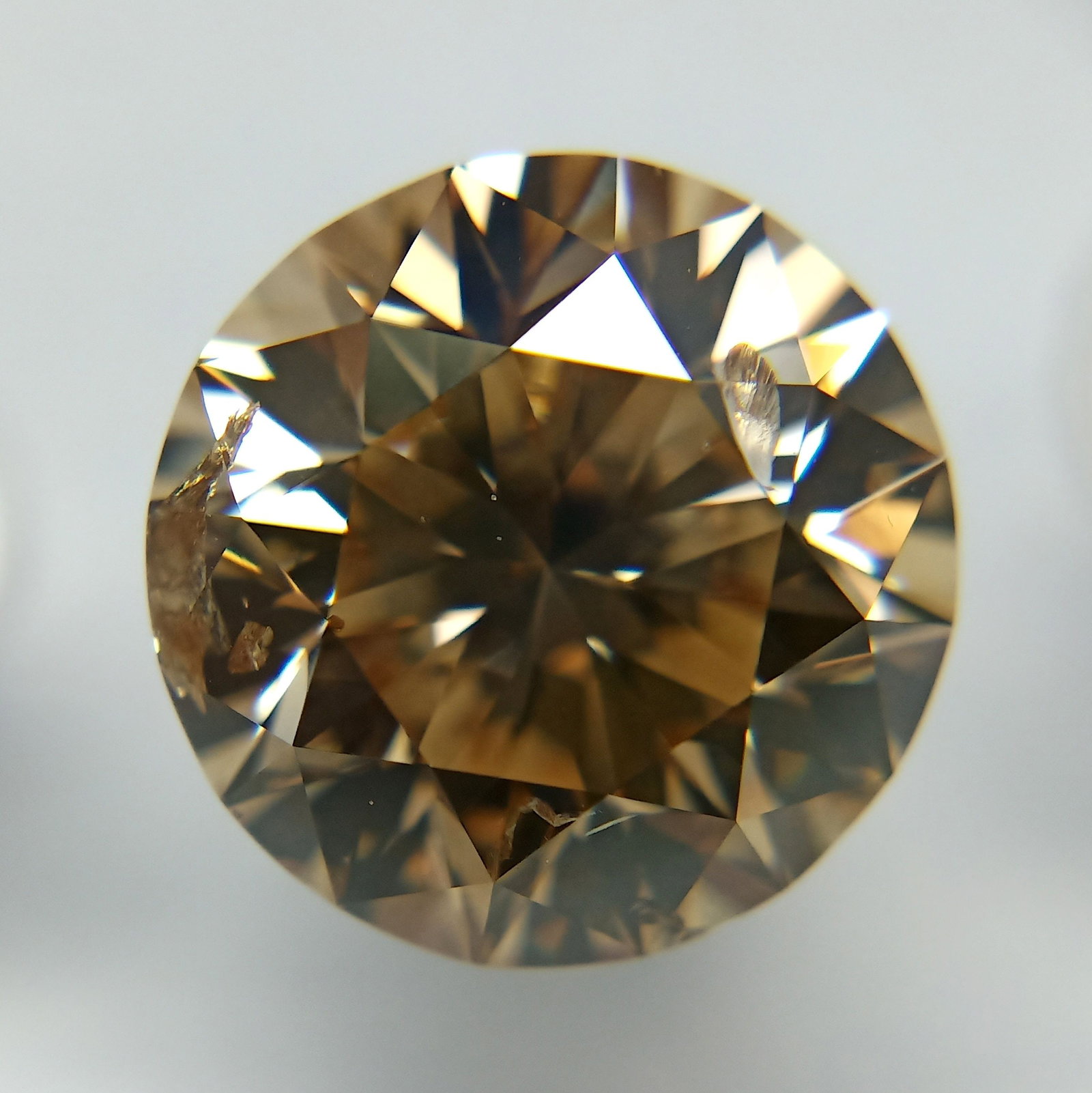 Loose Diamond - ROUND 5.02ct Fancy Yellowish Brown: Loose Diamond - ROUND 5.02ct Fancy Yellowish Brown Source: Natural Shape: ROUND Carats: 5.02 Color: Fancy Yellowish Brown Certification: GIA PLEASE NOTE: Framed, Large, or heavy items do not have ship