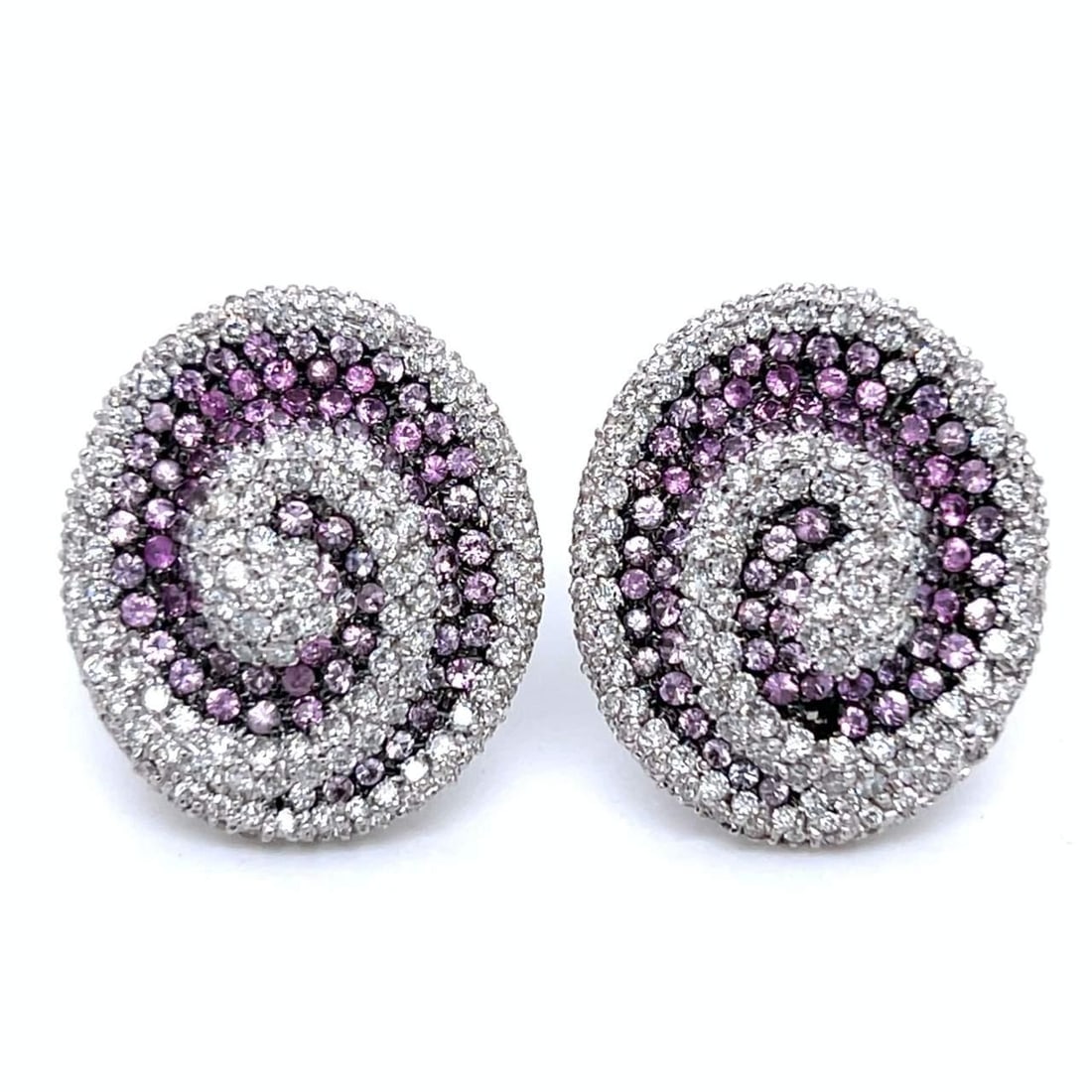 Elegant 18K White Gold Pink Sapphire Diamond Earrings 3.40 Ct: Elegant 18K White Gold Pink Sapphire Diamond Earrings 3.40 Ct These stunning 18K White Gold Earrings feature a captivating array of pink sapphires and diamonds. Weighing 20.2 grams, the earrings are a