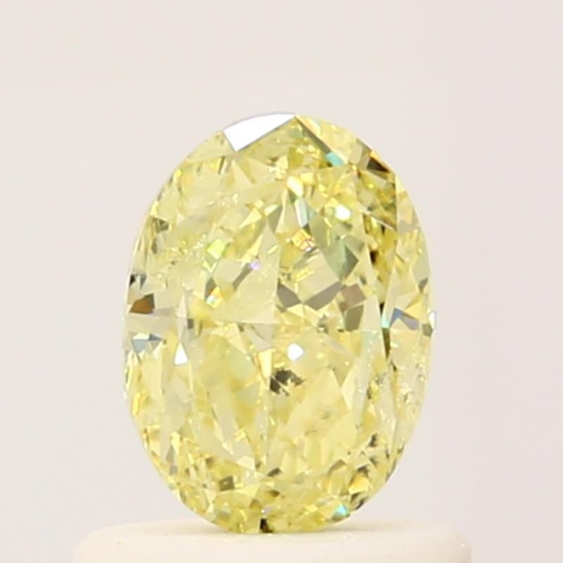 Loose Diamond - OVAL 0.72ct Fancy Light Yellow: Loose Diamond - OVAL 0.72ct Fancy Light Yellow Source: Natural Shape: OVAL Carats: 0.72 Color: Fancy Light Yellow Certification: GIA Video: