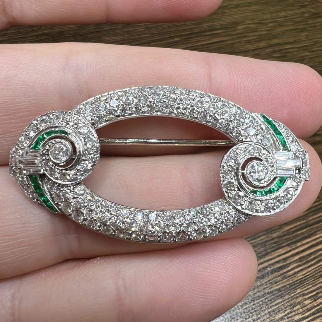 Art Deco Platinum Brooch with 120 Diamonds and Emeralds: Art Deco Platinum Brooch with 120 Diamonds and Emeralds This exquisite Art Deco brooch is crafted in platinum and features a stunning arrangement of gemstones. It is adorned with a total of 120 Europe